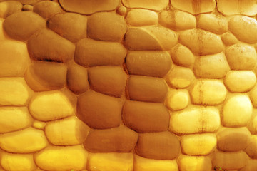 Golden stone wall construction background