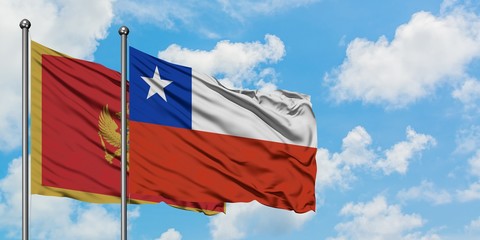 Montenegro and Chile flag waving in the wind against white cloudy blue sky together. Diplomacy concept, international relations.