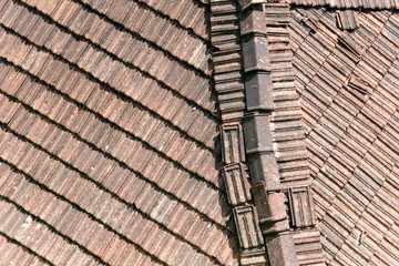 Fragment of a tiled roof on an old building