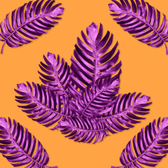Fototapeta na wymiar green monstera leaves pattern are made violet for nature concept,tropical leaf on orange background