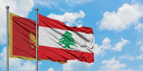 Montenegro and Lebanon flag waving in the wind against white cloudy blue sky together. Diplomacy concept, international relations.
