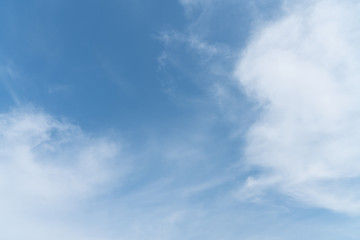 White cloud and blue sky background with copy space