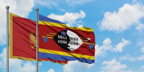 Montenegro and Swaziland flag waving in the wind against white cloudy blue sky together. Diplomacy...