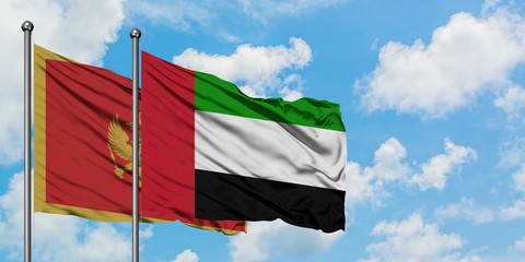 Montenegro and United Arab Emirates flag waving in the wind against white cloudy blue sky together. Diplomacy concept, international relations.