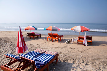 Sun umbrellas and chairs on beach