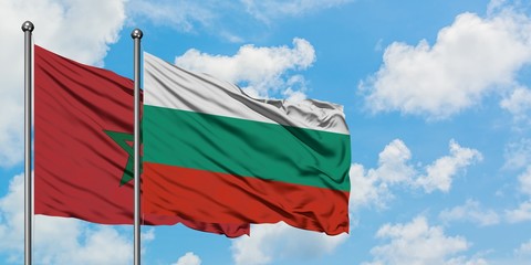 Morocco and Bulgaria flag waving in the wind against white cloudy blue sky together. Diplomacy concept, international relations.