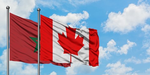Morocco and Canada flag waving in the wind against white cloudy blue sky together. Diplomacy concept, international relations.