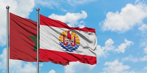 Morocco and French Polynesia flag waving in the wind against white cloudy blue sky together. Diplomacy concept, international relations.