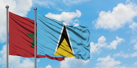 Morocco and Saint Lucia flag waving in the wind against white cloudy blue sky together. Diplomacy concept, international relations.