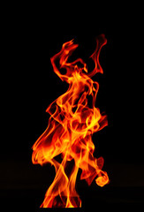 Fire flame isolated on black background. Beautiful Flame in the dark.