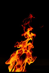 Fire flame isolated on black background. Expressive flame.