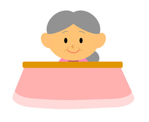 こたつでくつろぐおばあさん