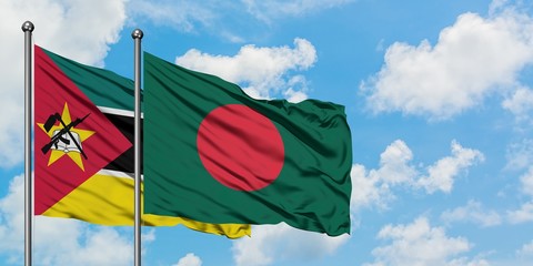 Mozambique and Bangladesh flag waving in the wind against white cloudy blue sky together. Diplomacy concept, international relations.