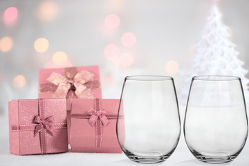 Glass mockup, with 2 stemless wine glasses, christmas theme, with pink presents, white christmas...