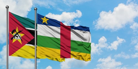 Mozambique and Central African Republic flag waving in the wind against white cloudy blue sky together. Diplomacy concept, international relations.