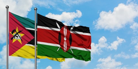 Mozambique and Kenya flag waving in the wind against white cloudy blue sky together. Diplomacy...