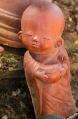 Fototapeta na wymiar cute baby buddha figurien in robes