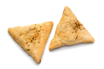 Triangular meat pie isolated on a white background.