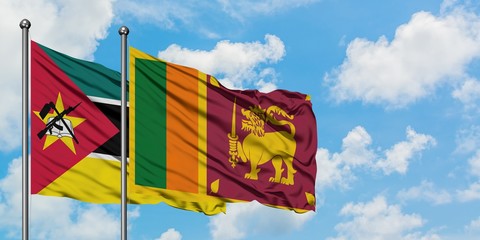 Mozambique and Sri Lanka flag waving in the wind against white cloudy blue sky together. Diplomacy concept, international relations.