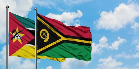 Mozambique and Vanuatu flag waving in the wind against white cloudy blue sky together. Diplomacy...