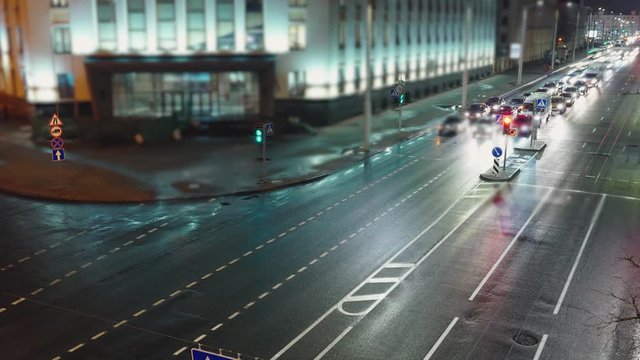 View down time lapse video crossroad intersection night lights. Traffic management.