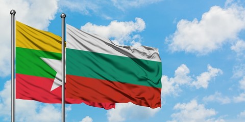 Myanmar and Bulgaria flag waving in the wind against white cloudy blue sky together. Diplomacy concept, international relations.