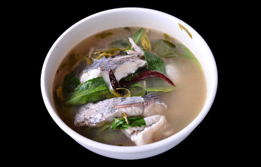 hot and sour soup tilapia fish in white plate . selective focus.