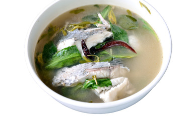 hot and sour soup tilapia fish in white plate . selective focus.