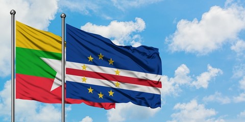 Myanmar and Cape Verde flag waving in the wind against white cloudy blue sky together. Diplomacy concept, international relations.
