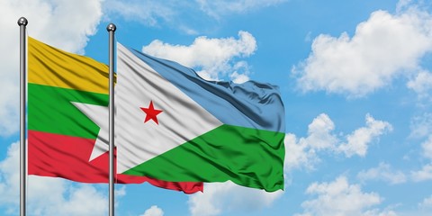 Myanmar and Djibouti flag waving in the wind against white cloudy blue sky together. Diplomacy concept, international relations.