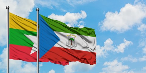 Myanmar and Equatorial Guinea flag waving in the wind against white cloudy blue sky together. Diplomacy concept, international relations.