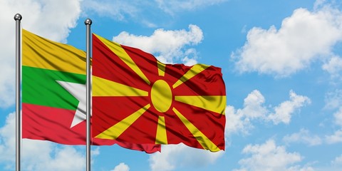 Myanmar and Macedonia flag waving in the wind against white cloudy blue sky together. Diplomacy concept, international relations.