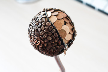 Topiary coffee tree with coins and lock