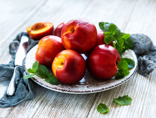 Plate with fresh nectarines