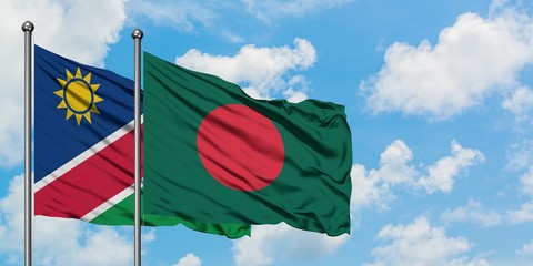 Namibia and Bangladesh flag waving in the wind against white cloudy blue sky together. Diplomacy concept, international relations.