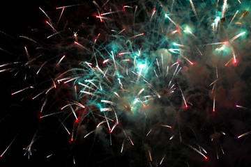 Colorful fireworks in the sky at night as background