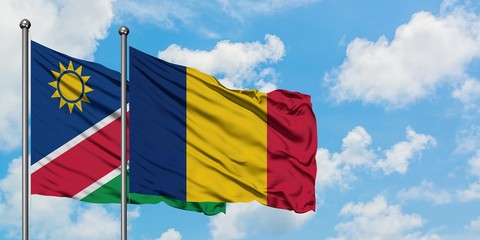 Namibia and Chad flag waving in the wind against white cloudy blue sky together. Diplomacy concept, international relations.