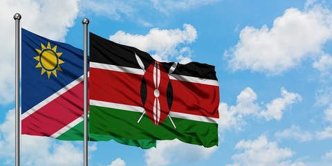 Namibia and Kenya flag waving in the wind against white cloudy blue sky together. Diplomacy...