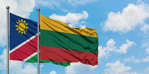 Namibia and Lithuania flag waving in the wind against white cloudy blue sky together. Diplomacy concept, international relations.
