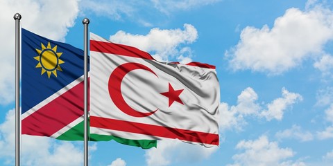 Namibia and Northern Cyprus flag waving in the wind against white cloudy blue sky together. Diplomacy concept, international relations.