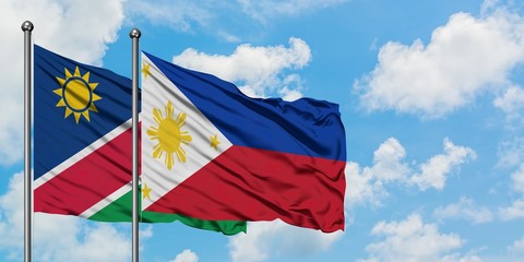 Namibia and Philippines flag waving in the wind against white cloudy blue sky together. Diplomacy concept, international relations.