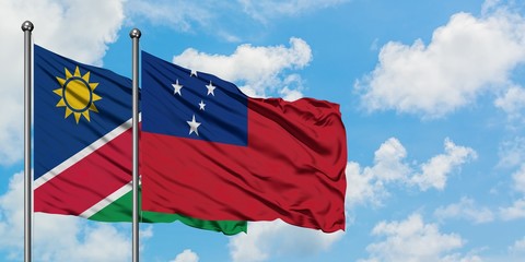 Namibia and Samoa flag waving in the wind against white cloudy blue sky together. Diplomacy concept, international relations.
