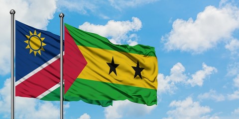 Namibia and Sao Tome And Principe flag waving in the wind against white cloudy blue sky together. Diplomacy concept, international relations.