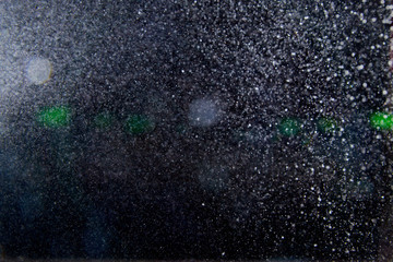 Abstract dust explosion and flash with illumination on a black background