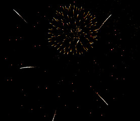 Fireworks sparkles in the night sky as background