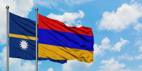 Nauru and Armenia flag waving in the wind against white cloudy blue sky together. Diplomacy concept, international relations.