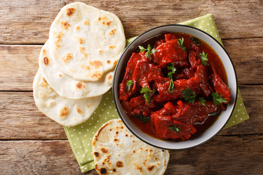 Recipe for Junglee Maas or Jungli Laal Maas close-up in the bowl. Horizontal top view