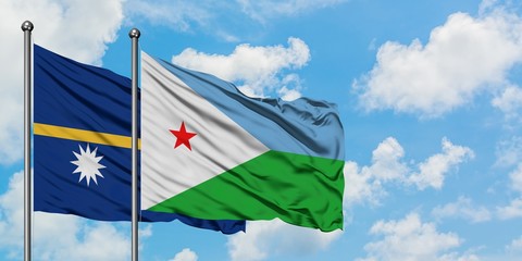 Nauru and Djibouti flag waving in the wind against white cloudy blue sky together. Diplomacy...