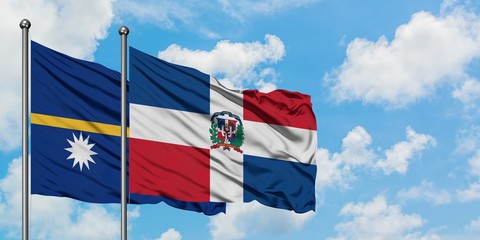 Nauru and Dominican Republic flag waving in the wind against white cloudy blue sky together. Diplomacy concept, international relations.