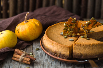 Thanksgiving pumpkin cake  top view, copy space. Fall traditional homemade pumpkin pie or cheesecake  for autumn holiday.